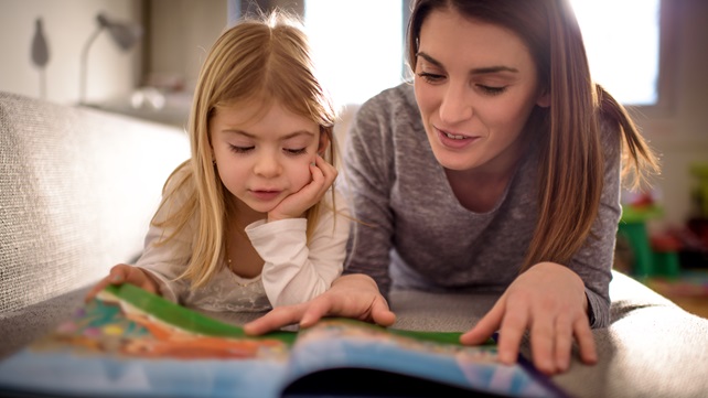 Mother reading with her young child