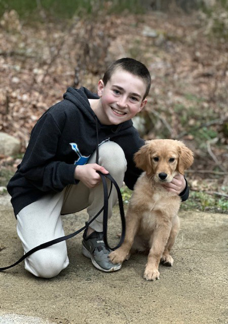 Grateful Patient AJ with his puppy