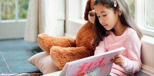 Young girl calming down with book