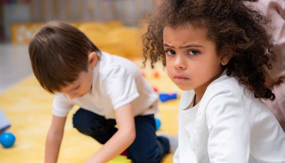 Unhappy child playing