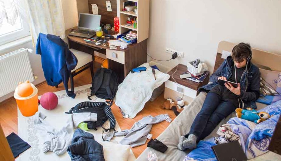 Teenager in messy room