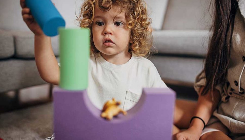 Toddler playing with blocks