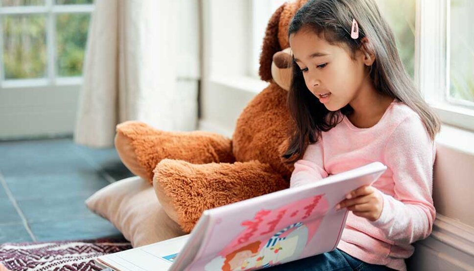 Young girl calming down with book