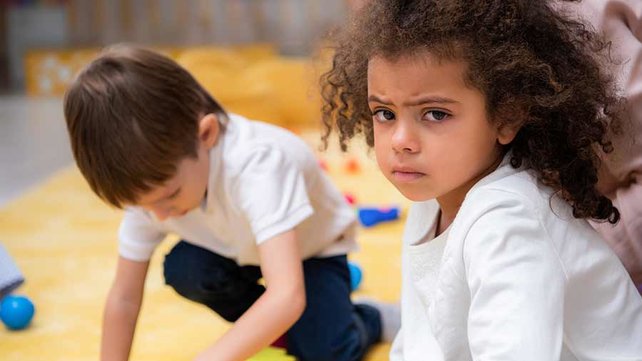 Unhappy child playing